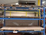 many shelves in the warehouse with many different types of wood