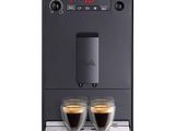 a close up of a coffee machine with two cups of coffee