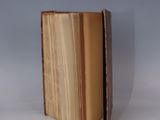 an open book sitting on top of a white table