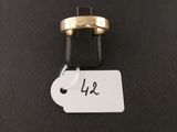 a gold ring with a price tag attached to it