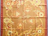 an image of a square scarf with a pattern of flowers and birds