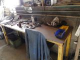 a workbench with tools on it in a garage