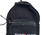 a black backpack with the word saint laurent on it