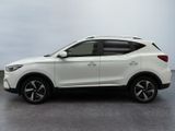 the white suv is parked on the concrete floor in the room