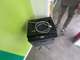 a person standing next to a small stove in a room