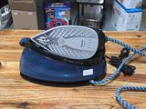 a blue and black iron on a wooden table
