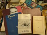 a pile of books and other items sitting on a table