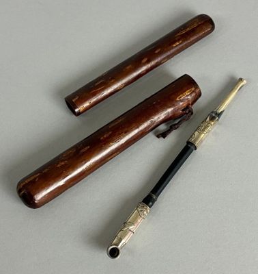 three different types of pipe holders on a table