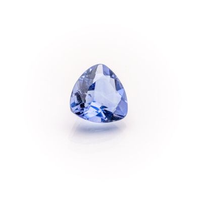 a blue sapphire stone on a white background