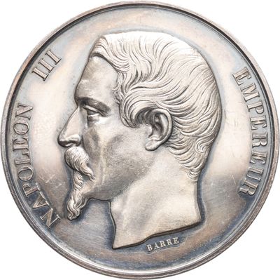 une vieille pièce d'argent sur laquelle figure le portrait d'un homme