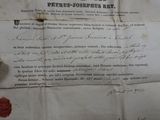 a piece of paper with writing on it and a spool of thread