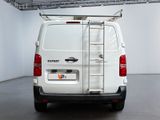 a white van with a ladder on the back of it
