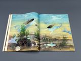 an open book with a picture of a fish and other animals