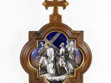 a wooden cross with a picture of jesus carrying the cross on it