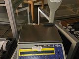 a scale that is sitting on a table in a room