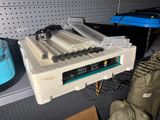 a box with a bunch of batteries in it on a shelf