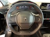 the interior of a car with a steering wheel and dashboard controls