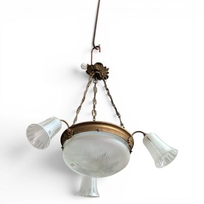 an image of a chandelier with three lights hanging from it ' s ceiling