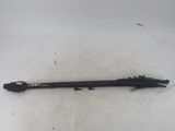 a black pen sitting on top of a white surface