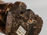a close up of a piece of wood with a label on it