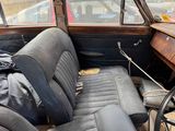 an old car that is sitting in the back of the car