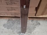 a cardboard box that is sitting on the floor next to a door