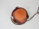 a brown glass bowl with a brown cord on it