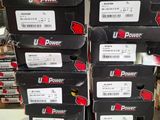 several boxes of u - power products are stacked on top of each other