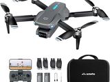 an image of a black drone with a camera and accessories
