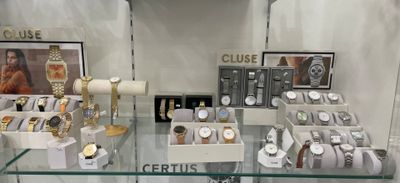 many watches on display in a glass case