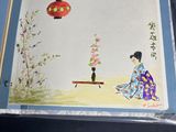 an open book with a picture of a woman sitting on a bench