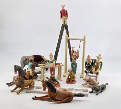 toy figurines of a man on a ladder with horses and dogs