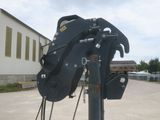 a close up of a crane on a pole in front of a building
