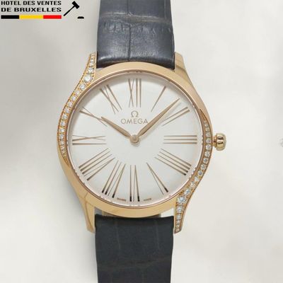an image of a close up of a watch on a white surface