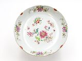 a white plate with a colorful floral design on it