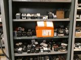 many different types of electronics on the shelves in this room