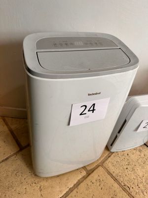 two trash cans sitting next to each other on the floor