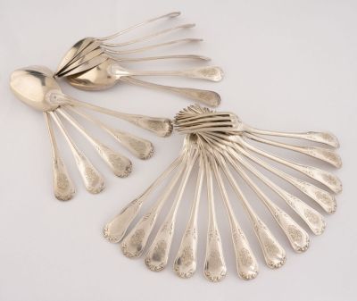 a lot of silver spoons and spoon spoons on a table