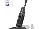 a close up of a vacuum cleaner and a bottle of cleaner