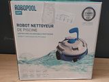packaging of a robot in a box on a wooden table