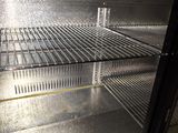 a glass door that is open to show the inside of a refrigerator
