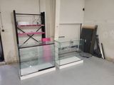 two glass cases in the middle of a room
