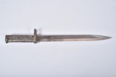 a knife that is laying on a white surface