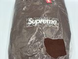 supreme skateboard bag in a plastic bag on a white surface