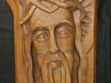 a close up of a carving of a man with a crown on his head