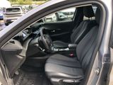 the interior of a car with the driver ' s seat folded down