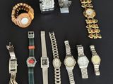 a lot of watches and bracelets on a table