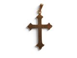 a close up of a wooden cross on a white background