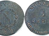 a close up of a coin on a white surface