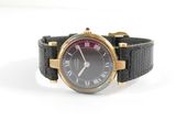 an image of a black and gold watch with roman numerals